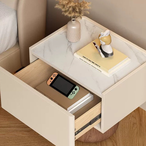 French-style granite bedside cabinet for a minimalist, modern and luxurious bedroom, providing storage space at the bedside.